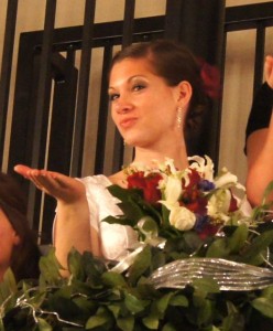 Ivy House bride blowing kisses to her beau from the spiral staircase