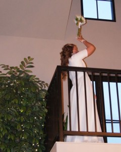 Tossing the bouquet from the balcony