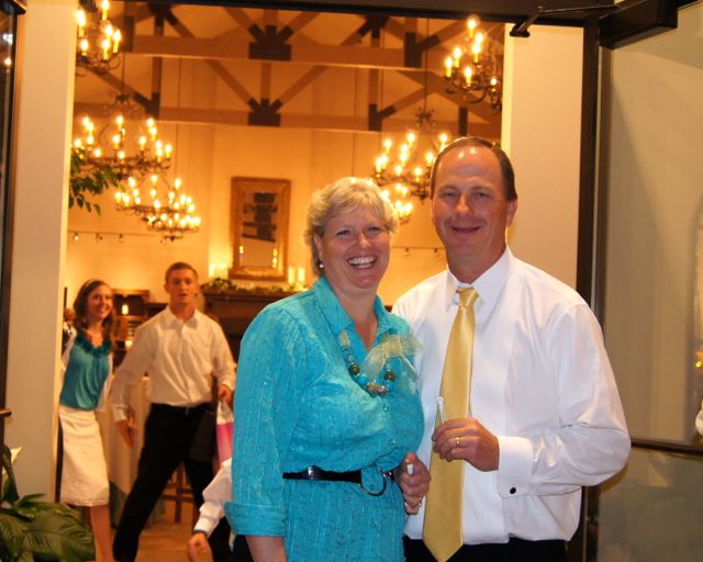 Happy bridal parents at wedding reception in Utah - Here come the newlyweds!